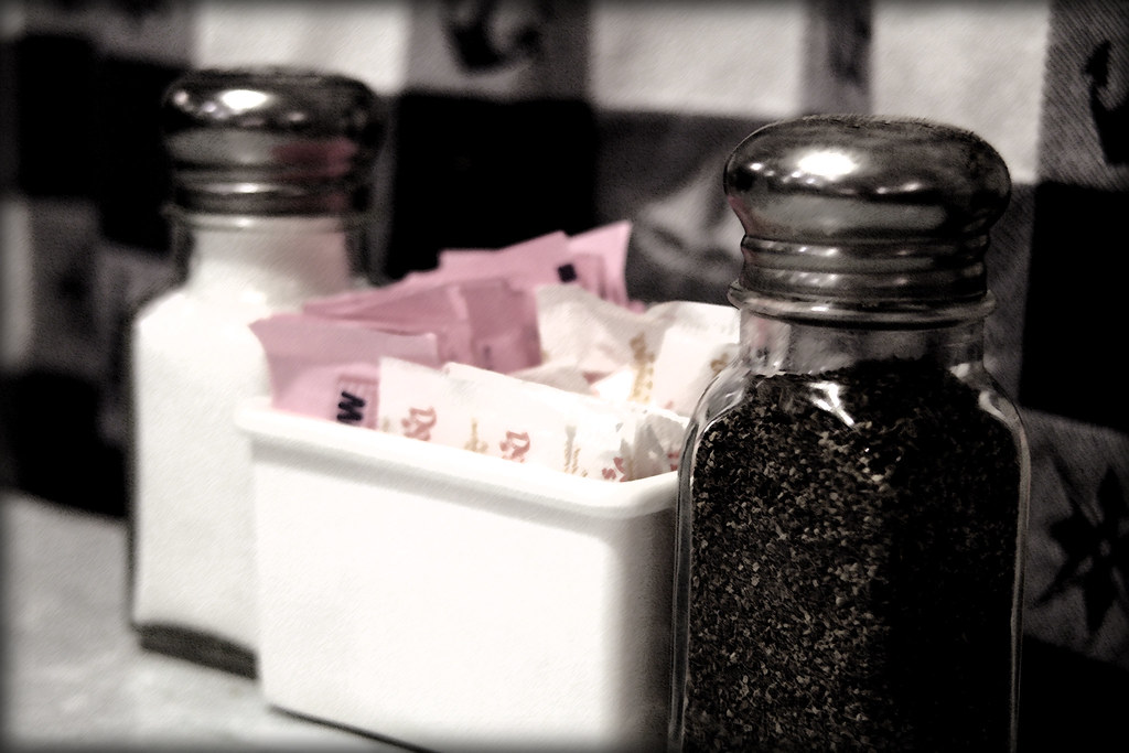 Placeholder image — shaker with creatine powder next to a training bag